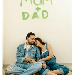 Officially 'Mom + Dad'! This happy portrait captures the excitement and joy of sharing their news with the world.