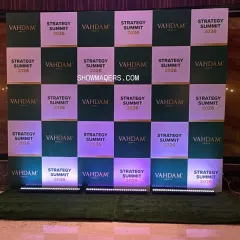 A branded media wall is essential for photo opportunities and social media engagement. We created this checkerboard-patterned backdrop for the Vahdam Summit, ensuring brand visibility in every photograph.