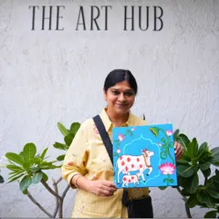 I offer a creative detox for adults to unwind, paint, and rediscover themselves. This student is showcasing her beautiful traditional Indian cow painting, created during a relaxing session at the studio.