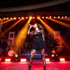 A dark and dramatic stage look for Dhvani. The custom black top, ruffled skirt, and lace tights create a powerful, rock-chic vibe.