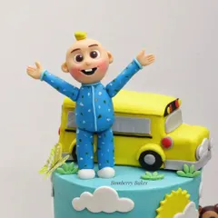 A close-up of the hand-sculpted JJ figurine from the Cocomelon cake.