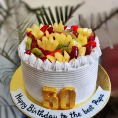 Celebrating a 50th birthday with this fresh and delicious mixed fruit cake. It's loaded with pineapple, kiwi, grapes, and apples, making it a lighter option for a big milestone.
