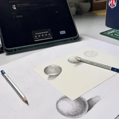 Practicing how to shade spheres to understand how light and shadow create a three dimensional form. I often do these exercises while taking my online classes.