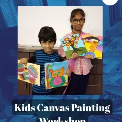 A splash of colour and a dash of joy! These two had a blast at a kids' canvas painting workshop, proudly showing off their very own masterpieces. Look at that colourful owl and the abstract portrait!