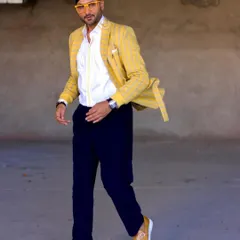 Harbhajan Singh in motion, wearing the custom yellow blazer. The movement shows the comfortable fit and stylish design, making it a versatile piece for any event.