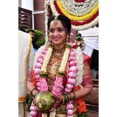 A happy moment during the Gouri Pooja. The makeup is kept fresh and traditional, with glowing skin and a smile that lights up the room.