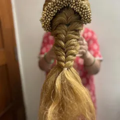 Another angle of the fishtail braid practice, showing how the hair is woven for a clean and symmetrical look. Mastering this on a mannequin builds the muscle memory needed for real clients.