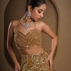 A closer portrait to showcase the intricate beadwork on the halter top and the matching diamond necklace. This type of shot is essential for showing the quality and detail of high-end fashion and jewelry.