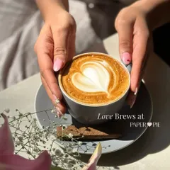 It’s more than just coffee, it’s a little piece of art. Our baristas take pride in every cup, like this perfectly poured latte with heart art, served with a side of flowers and good vibes.