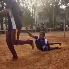 Another angle of a dive, showing the technique of getting low to the ground to make a successful tag while maintaining speed.