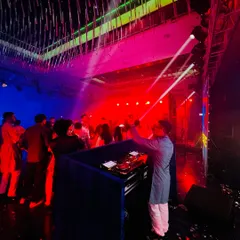 Whether it's a club or a wedding, the energy needs to be high. This shot captures the incredible lighting and atmosphere of a private sangeet night.