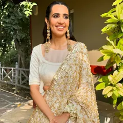 The full look for this bride's Haryanvi-inspired Mehendi. Her radiant smile and the traditional elements of her makeup and hair came together to create a look that was truly heartfelt and beautiful.