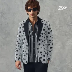 A closer look at our polka dot blazer. The contrasting black lapel and bold pattern make this a standout piece for the fashion-forward man.