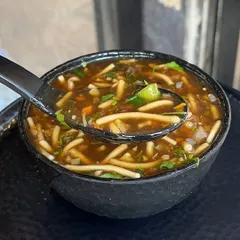 A warm bowl of Manchow Soup is perfect for any weather. It's a flavourful and hearty vegetable soup topped with crispy fried noodles for that extra crunch.