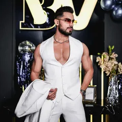 The waistcoat of our all-white three-piece suit, worn on its own for a bold, confident statement. This shows the versatility of a bespoke ensemble, where each piece is strong enough to be a hero.
