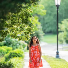 A thoughtful portrait of my daughter. The natural frame created by the leaves adds a beautiful touch to this outdoor photo.