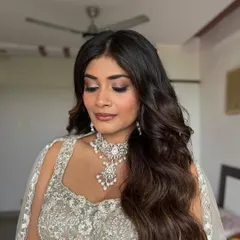 A detailed look at the soft, shimmery eyeshadow I created for this bride. The pink and champagne tones beautifully complement her silver lehenga and diamond jewelry.