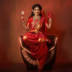 A striking studio portrait from my Navratri Devi concept series, embodying the divine feminine energy of Shakti with traditional red attire and symbolic gestures.