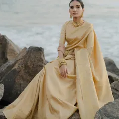 The stillness of the ocean meeting the grace of tradition. I directed this bridal portrait to capture the timeless elegance of a South Indian bride, styling her golden Kanjivaram saree against the rugged shoreline for a powerful, poetic contrast.