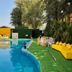 This poolside Haldi setup combines bright yellow decor with the natural beauty of the venue. I arranged comfortable lounge seating and tables by the pool, creating a relaxed and festive atmosphere for the celebration.