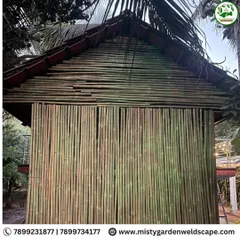 An exclusive bamboo house with a classic Mangalore tile roof. This eco-friendly structure combines sustainable materials with traditional design for a timeless farmhouse retreat.