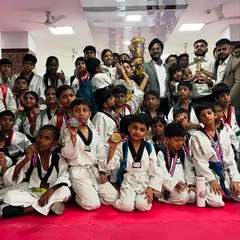 A proud moment for the entire team. My students, young and old, showing off their hard-earned medals and the team trophy. Every single win is a team effort.