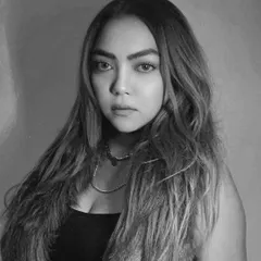 Focused, unbothered, glowing. A black and white portrait capturing a moment of inner peace and confidence.