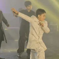 This little guy is bringing all the style and swag to his sangeet performance. It's amazing to see kids embrace the stage with such energy.
