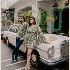 A retro-themed shot with Kunal and Disha posing with a vintage Mercedes in Thailand, adding a touch of old-school cool to their pre-wedding shoot.