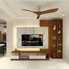 In this design, we framed a textured, marble-patterned back panel with rich wood. A tall display cabinet on the side offers vertical storage, balancing the low-profile media console.