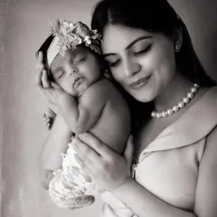 The quiet magic between a mother and her newborn. This classic black and white portrait highlights the soft light and even softer love in this timeless moment of motherhood.