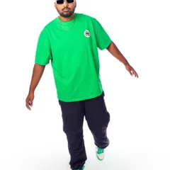 'Unavailable for BS'. A simple, confident pose in a bright green tee, showing my no-nonsense attitude.