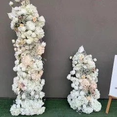 For weddings and formal events, I create elegant floral pillars like these. Made with high-quality artificial white roses, hydrangeas, and other mixed flowers, they are perfect for decorating a stage, entrance, or wedding aisle. They provide a classic look that lasts through the entire event.