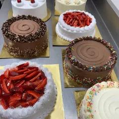 A lineup of some of our classic cakes ready for delivery. From fresh strawberry to rich chocolate, we promise you won't be disappointed with our variety and quality.