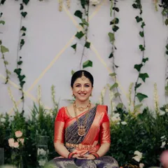 A beautiful portrait of the bride, Sonika. The backdrop of hanging ivy and delicate flowers creates a soft, romantic feel, highlighting the intricate details of our floral designs.