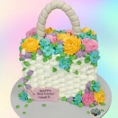 A surprise gift inside a cake. This floral basket cake was designed to hold an iPhone inside, revealing an amazing gift when the cake is cut.