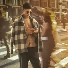 A dynamic and modern urban shot. I used a projected city background and motion blur to create a sense of energy, with the model as the calm, focused center of the scene.