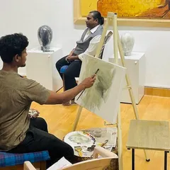 A mid-session view of the live demonstration at Rendition Art Gallery. Here, you can see the model posing as I work on capturing his profile and the structure of his face with layered brushstrokes.