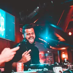 This is me in my element. That moment when the beat drops, the crowd roars, and everything just clicks. I live for creating these small moments of pure energy on the dance floor.