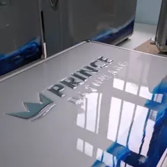 This image shows the glossy, reflective finish on the custom briefcases. The resin not only adds a unique design element but also provides a durable and premium-feeling surface.