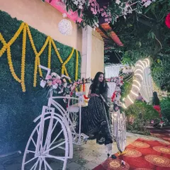 My partner posing with a decorative bicycle at a wedding. It's always a joy to see and capture the fun details at events.