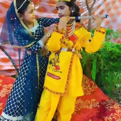We love creating magical moments for our youngest dancers. Here are two of our students dressed as Radha and Krishna for a Janmashtami celebration, fully costumed and ready for their performance.