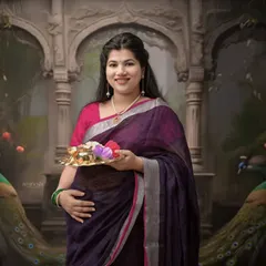 Here is another take on the traditional theme, set against a backdrop inspired by royal Indian architecture. The rich colors of her saree stand out beautifully.