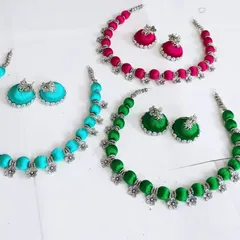 A duplicate image showing the vibrant silk thread necklace sets. I can customize these in any color, from neon green to turmeric yellow, to match your theme.