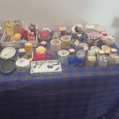 This is a snapshot of my stall at a local event, showcasing the variety of products I create. You can see my handmade candles, soaps, and cosmetics, all available for your custom hampers.