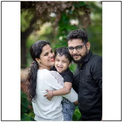 A happy family portrait taken during an outdoor session. I focus on capturing the natural joy and love between parents and their child.