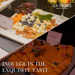 We present an exquisite taste of classic European cheeses. This platter features a soft, creamy Brie from France and a robust English Cheddar, perfectly balanced with almonds, dried apricots, and fresh berries.