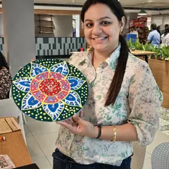 The smile of a proud artist says it all. This participant is showing off her beautifully detailed and colorful Lippan art piece. My goal is for every person to leave the workshop with a creation they are genuinely proud of.