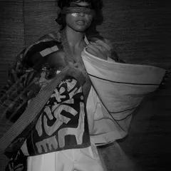 An abstract and powerful black and white shot from a conceptual campaign. The blindfold and layered, deconstructed garments create a thought-provoking image that is pure art.
