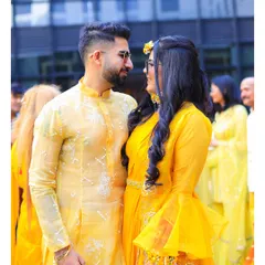 A candid moment between the couple at their Haldi function. Dressed in coordinated yellow outfits, their shared glance tells a story of love and excitement for the journey ahead.